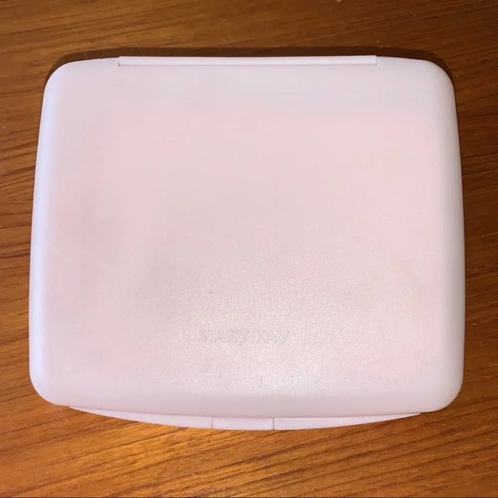 Mary Kay pink plastic compact travel mirror.
